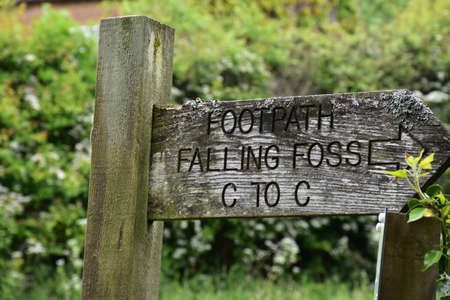 Sign marker on Coast to Coast trail indicating Falling Foss の写真素材