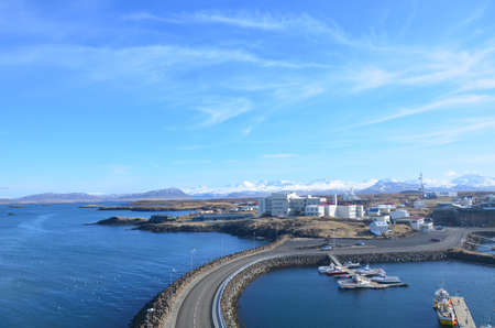 Stone causeway connecting Sugandisey Lookout to Stykkisholmur Iceland.