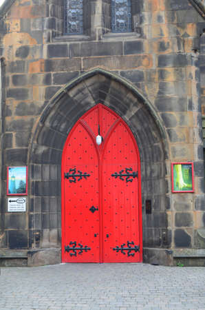 Red door and archway in Edinburgh Scotland.の写真素材