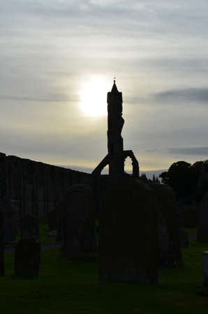 Sun setting behind the ruins of St Andrew'd Cathedral.の写真素材