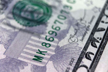 Macro capture of United States currency and bills.