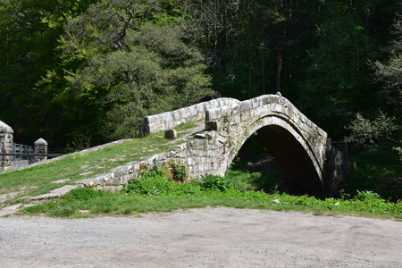Historic bridge over a river in England.