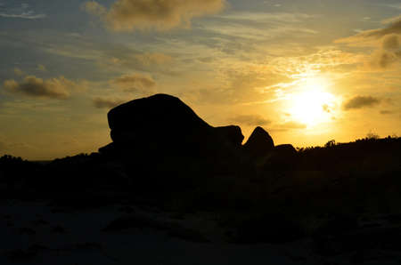 Gorgeous silhouetted rock at sunrise in Aruba.