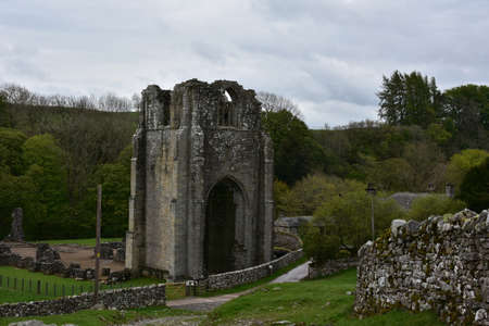 Shap Abbey bell tower ruins and remains in the English countryside.