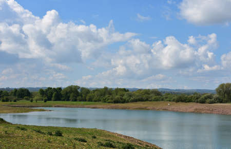 Beautiful landscape with a winding slow moving river through the countryside.の写真素材
