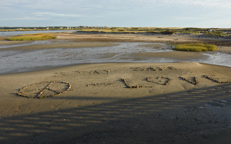 Peace symbol, love in the rocks and stay safe message.