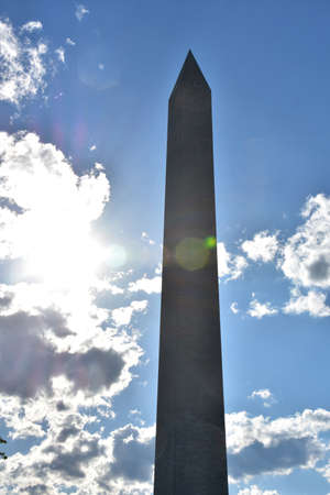 Thick cloudy skies surrounding the iconic Washington Monument in DC.の写真素材