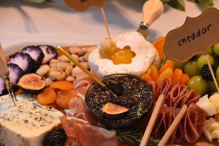 Snack tray and charcuterie board with fruit and cheese.