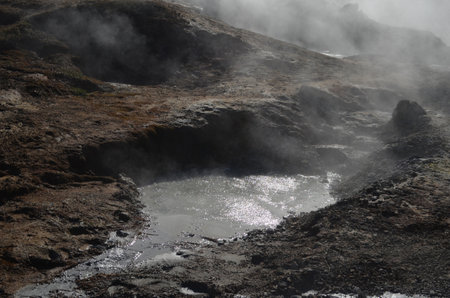 Steaming and bubbling mud in a natural Icelandic hot spring.