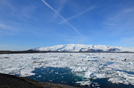 Beautiful ice flow and icebergs in a melting lagoon in Iceland.