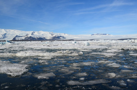 Flow of ice in Jokulsarlon lake in southern Iceland in the summer.