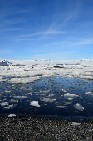 Beautiful views of icey landscape under blue skies in Jokulsarlon Iceland.