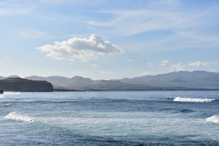 Brilliant scenic views of the ocean and hills in the Azores.の写真素材