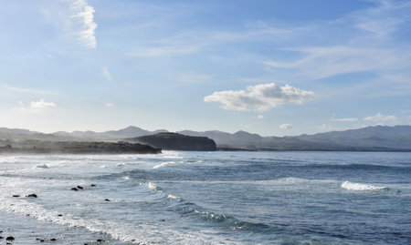 Lovely coastline with picture perfect with rolling waves.の写真素材