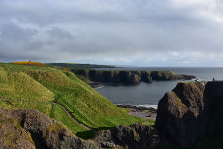 Gorgeous scenic views of sea cliffs towering over the ocean waters.の写真素材