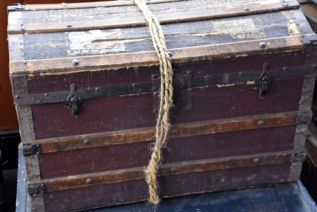 Old fashioned steamer trunk with locks on the front.