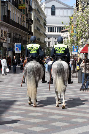 Patrolling policemen on Horseback in the center of Madrid(Spain)-07.04.2010のeditorial素材
