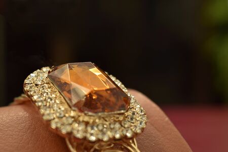 accessories Is a gold bracelet decorated with yellow jewels, beautiful, luxurious and expensive