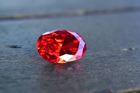 ruby Is a beautiful red gemstone on a wooden floorの写真素材