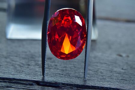 ruby Is a beautiful red gemstone on a wooden floorの写真素材