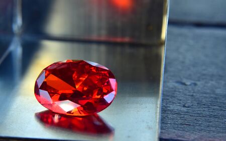 ruby Is a beautiful red gemstone on a wooden floorの写真素材