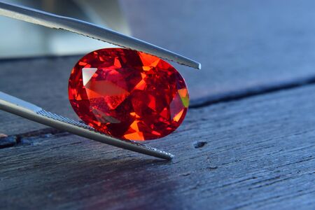 ruby Is a beautiful red gemstone on a wooden floorの写真素材