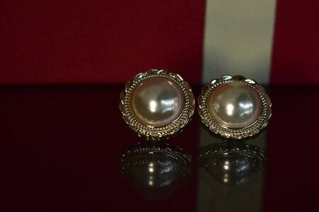 Gold earrings Decorated with pearl Luxurious and beautifulの写真素材