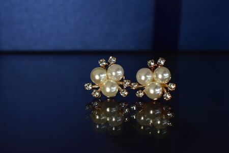 Gold earrings Decorated with pearl Luxurious and beautifulの写真素材