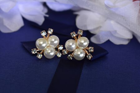 Gold earrings Decorated with pearl Luxurious and beautifulの写真素材