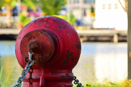 Water pipe shutters There is a large red plumbing beside the pool.の写真素材