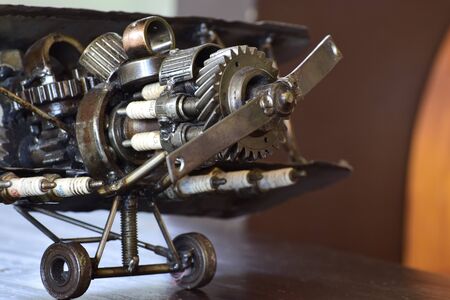 The plane is a toy made of steel and various equipment. Assembled together