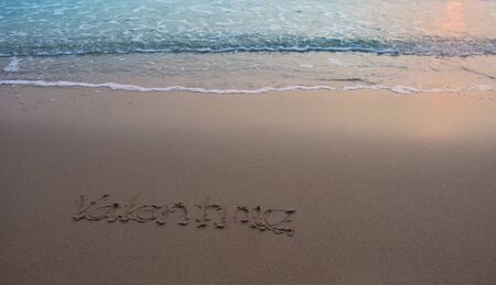 On the sand there is a letter written valentime.の写真素材