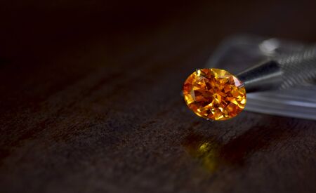 Yellow gem Beautiful on the wooden floorの写真素材