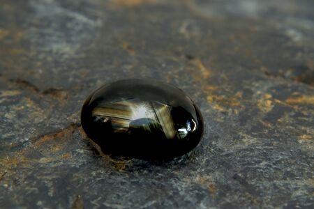 Yellow star gem Beautiful on the wooden floorの写真素材