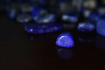 Lapis Is a beautiful natural gemstone on a wooden floor
