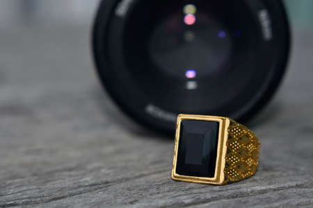 jewelry is a gold ring decorated with onyx