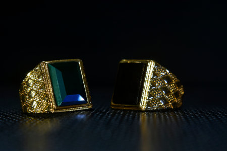 jewelry is a gold ring decorated with onyxの写真素材