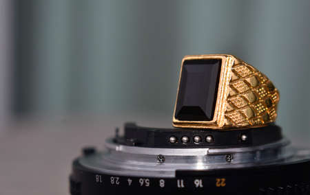 jewelry is a gold ring decorated with onyxの写真素材