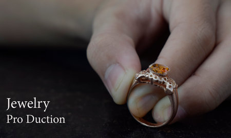 jewelry production ring and yellow gemstonejewelry, closeup