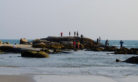 Beach, Mae Ramphueng Beach, with people walking and children playing in the sea. Recorded on September 15, 2021, Rayong, Thailand.のeditorial素材