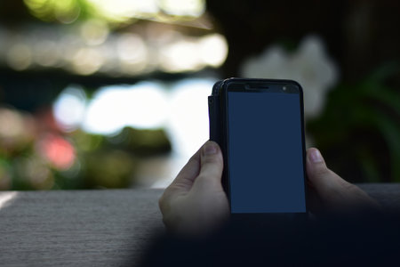 online business is technology girl playing on the phone social media ageの写真素材