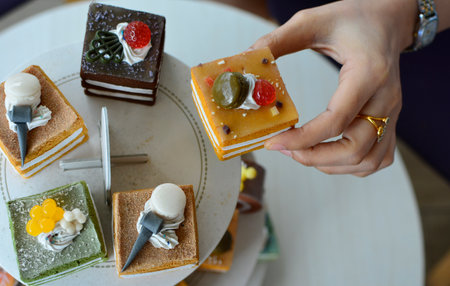 Close-up shot, hand holdingfood and coffee drink