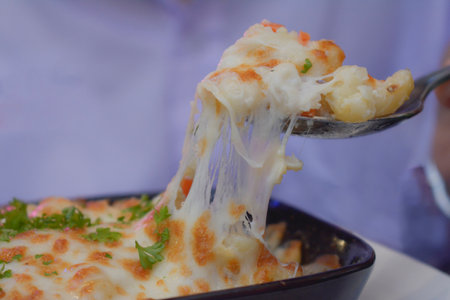 Close-up shot, hand holdingfood and coffee drink
