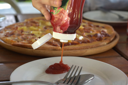 Hands are cooking and holding food.の写真素材