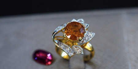 Diamond ring decorated with multi-colored gemsの写真素材