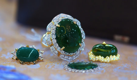 Diamond ring decorated with multi-colored gemsの写真素材