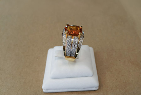 Gold ring decorated with carefully selected yellow gems and real diamonds. Expensive jewelry.の写真素材