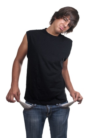 Teen showing his empty pockets on white backgroundの写真素材