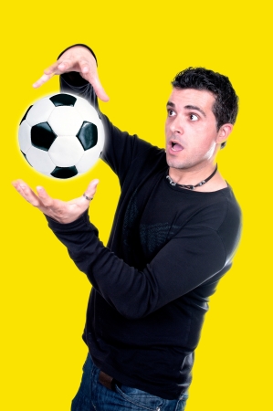 portrait of a man playing with a soccer ball の写真素材
