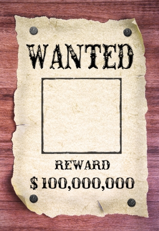 Wanted poster on wood backgroundの写真素材
